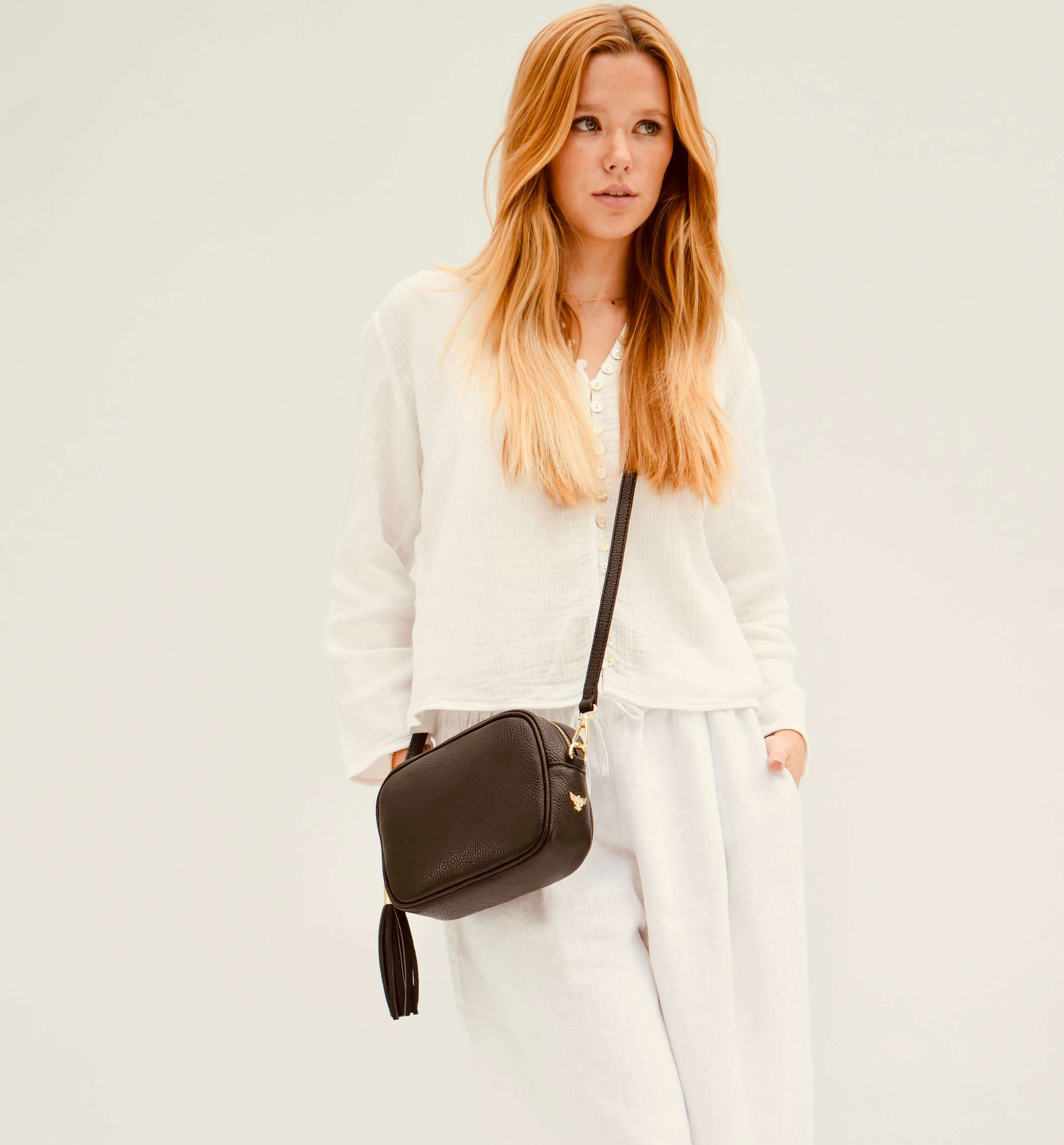 The Tassel Black Leather Crossbody Bag With Midnight Zigzag Strap
