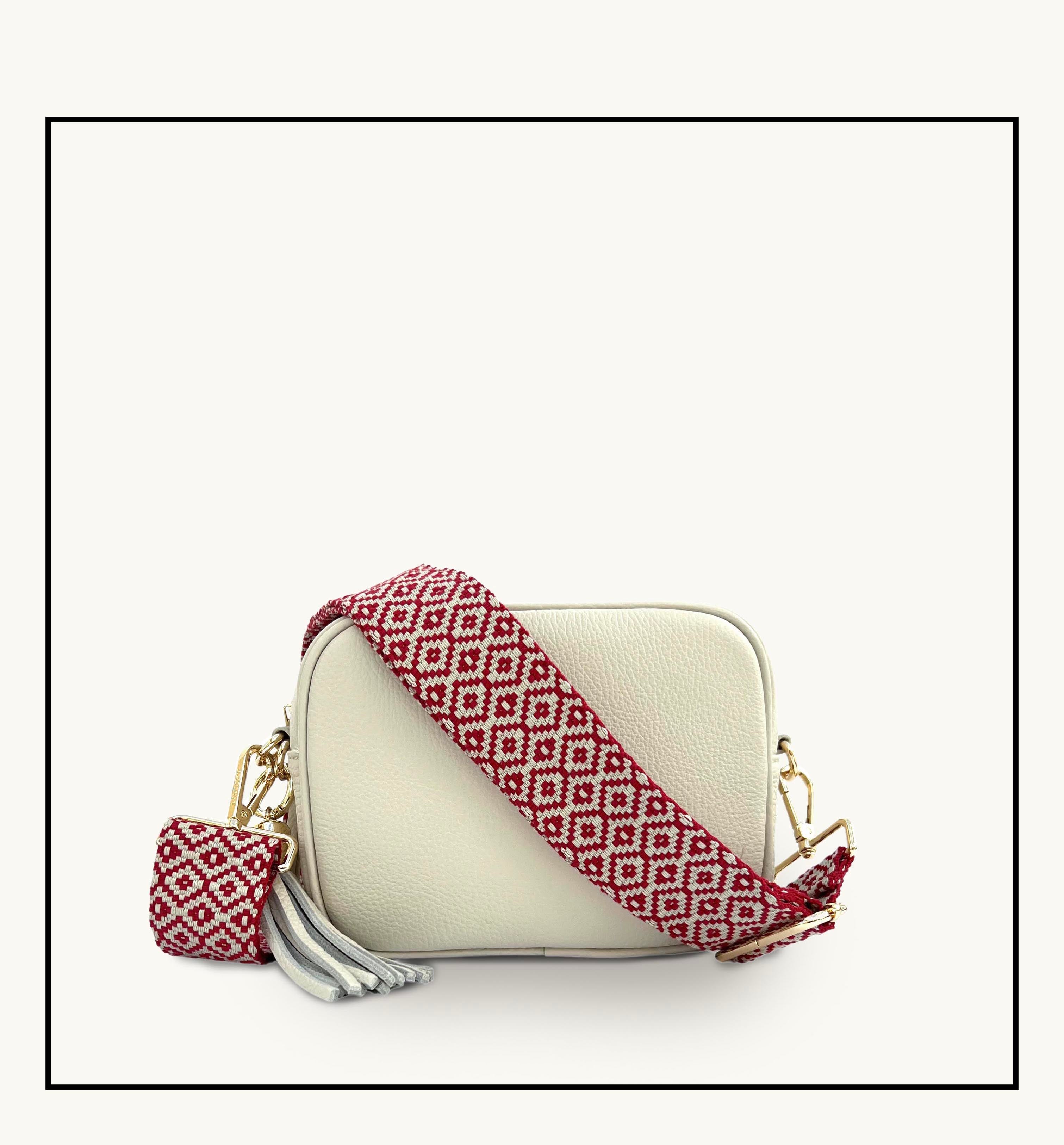 The Tassel Stone Leather Crossbody Bag With Red Cross-Stitch Strap