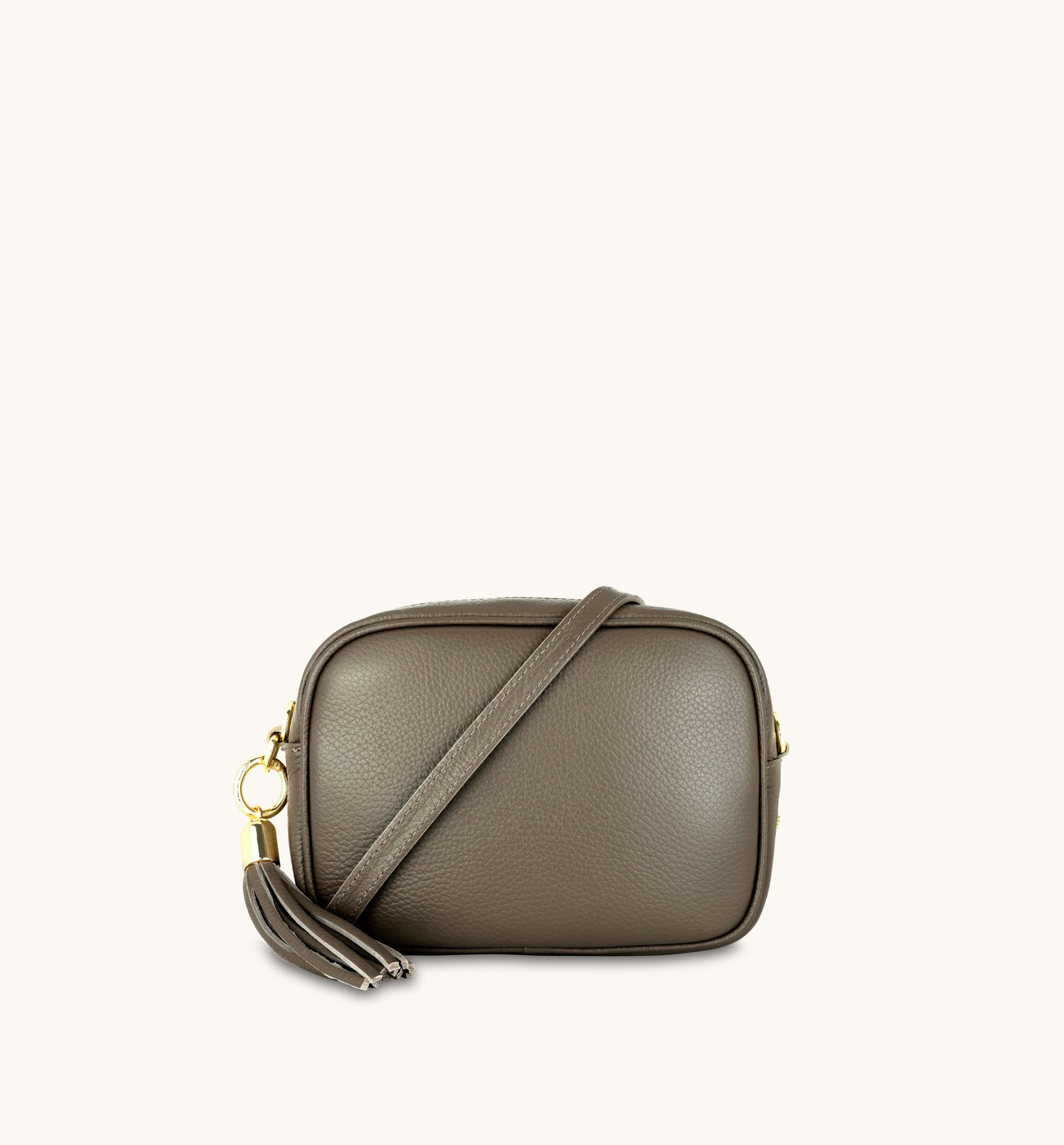 The Tassel Latte Leather Crossbody Bag With Orange, Tan & Black Stripe Strap