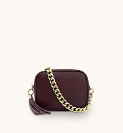 The Tassel Burgundy Leather Crossbody Bag With Gold Chain Strap
