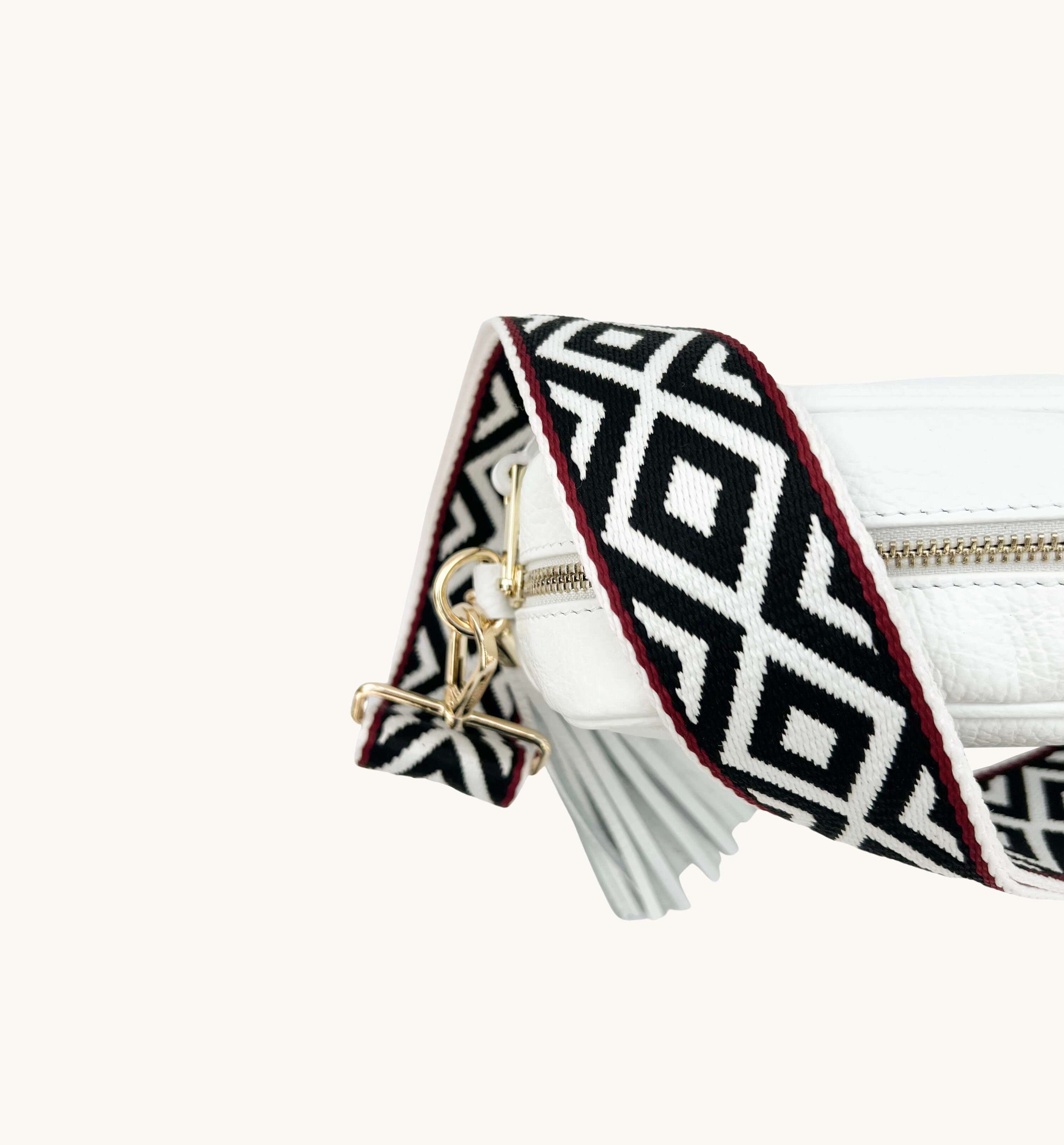 The Tassel White Leather Crossbody Bag With Black & Red Aztec Strap