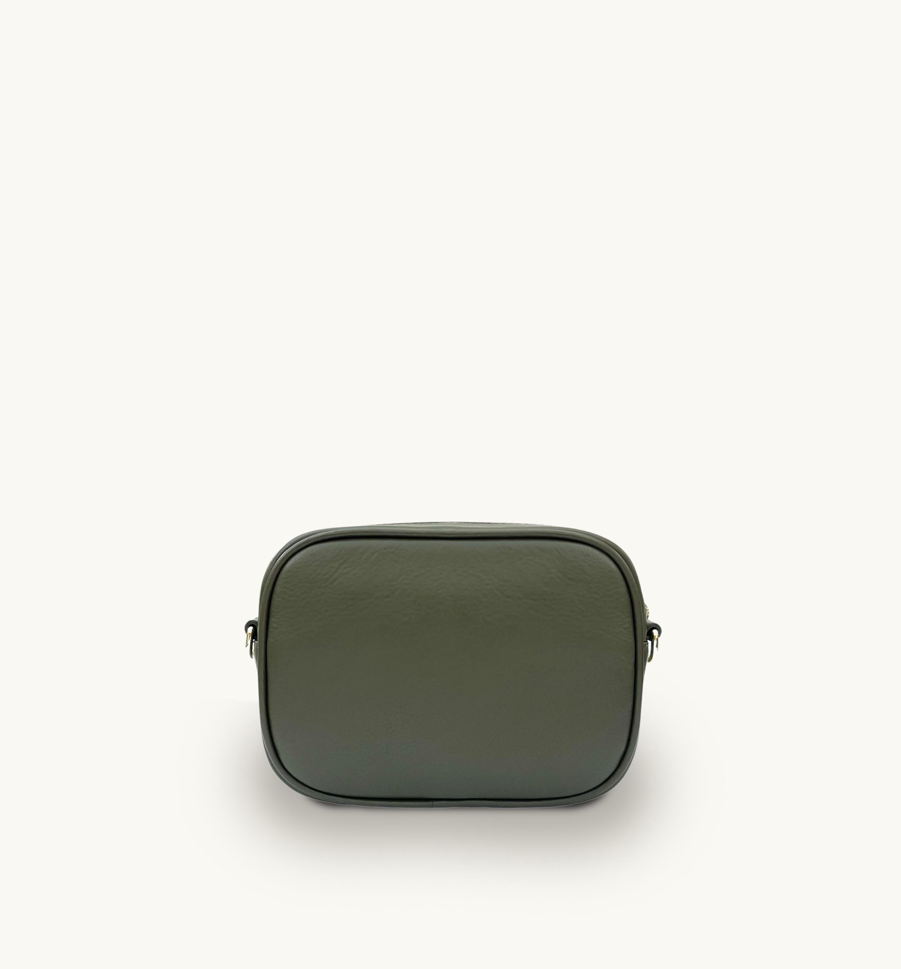 Green leather bag on a white background