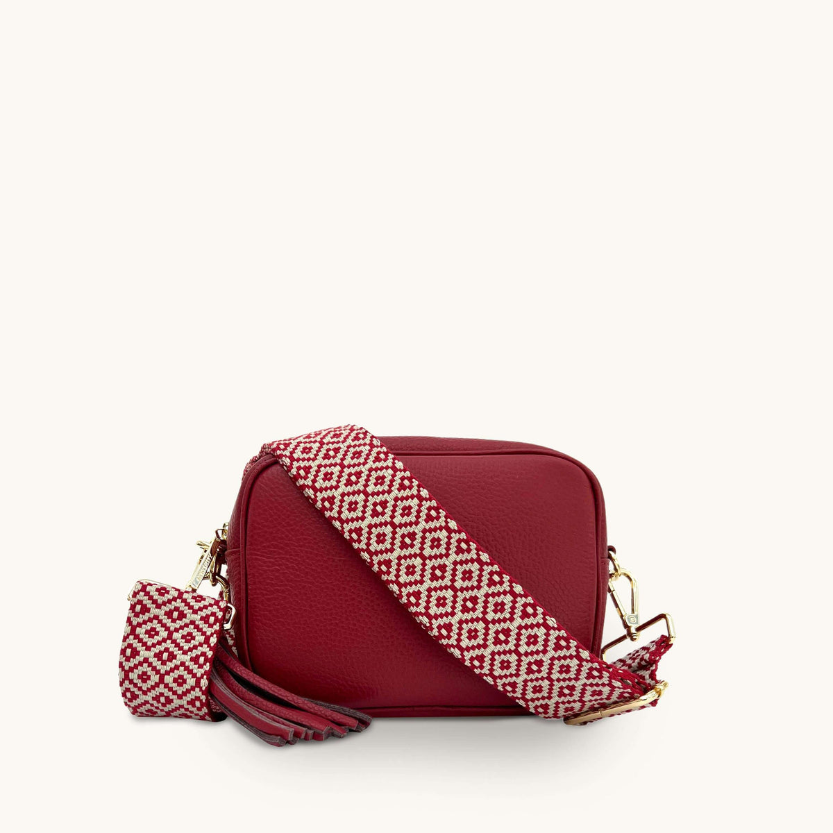 The Tassel Cherry Red Leather Crossbody Bag With Red Cross-Stitch Stra
