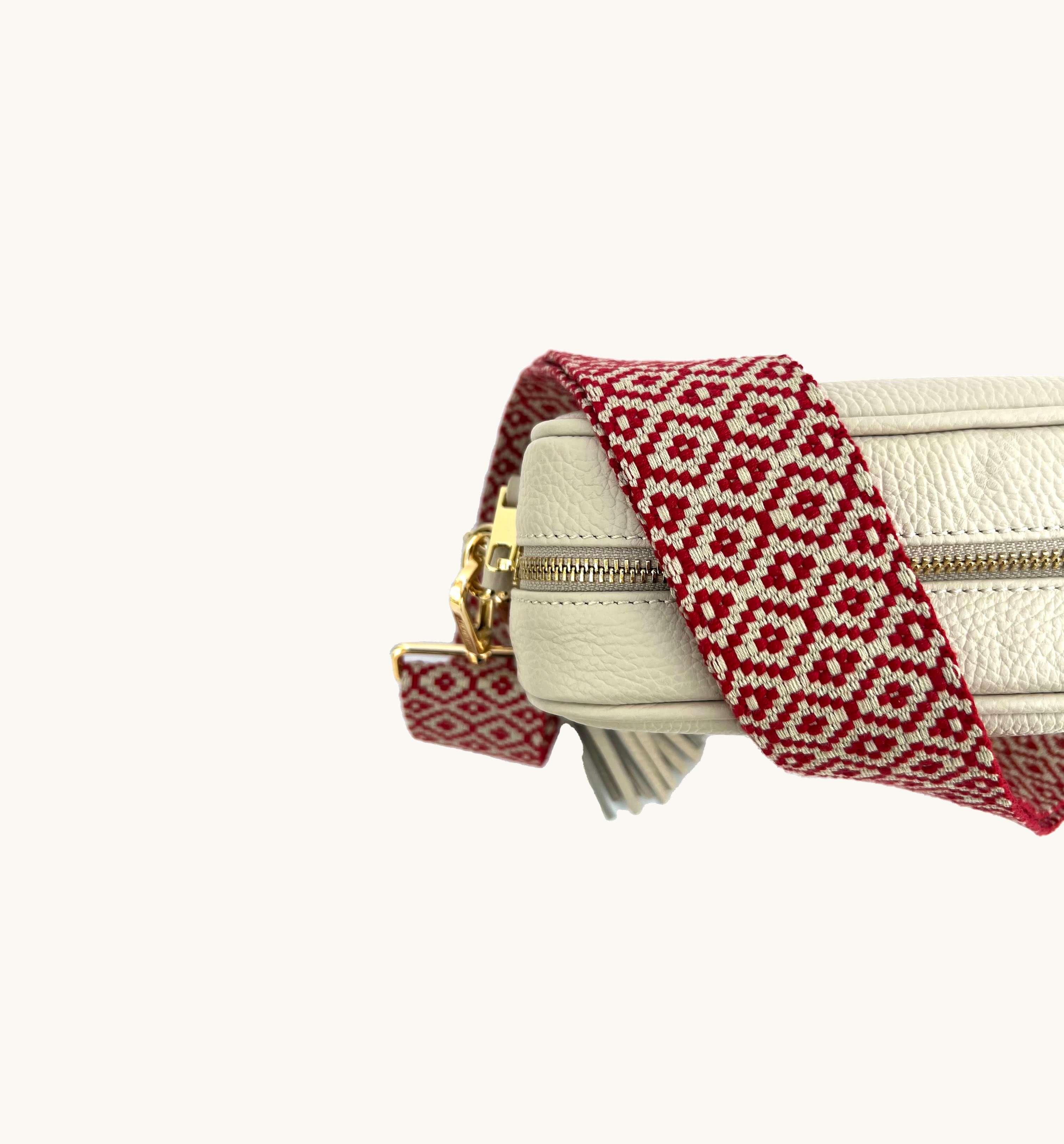 The Tassel Stone Leather Crossbody Bag With Red Cross-Stitch Strap