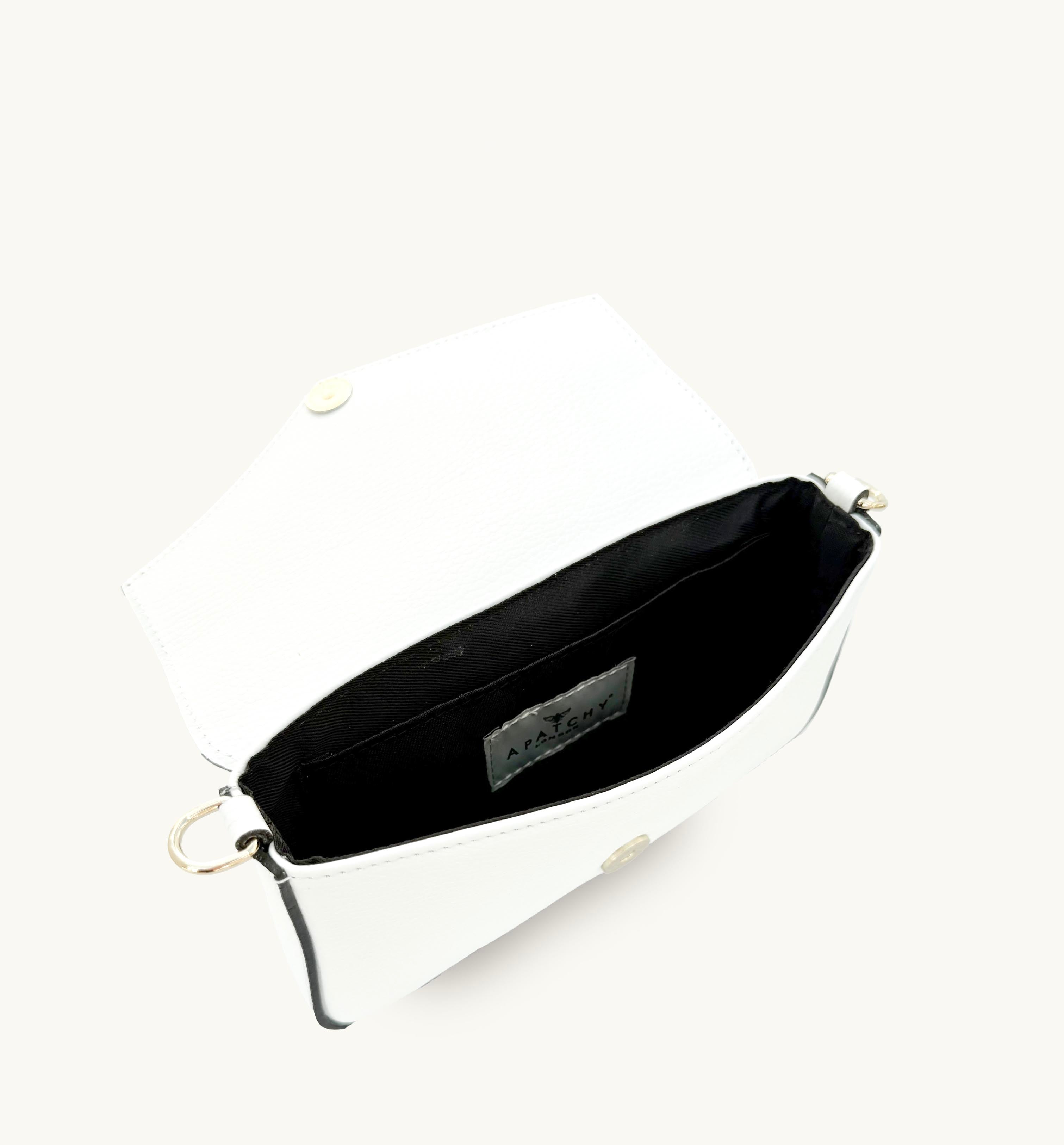 White leather handbag with a brand label on a white background