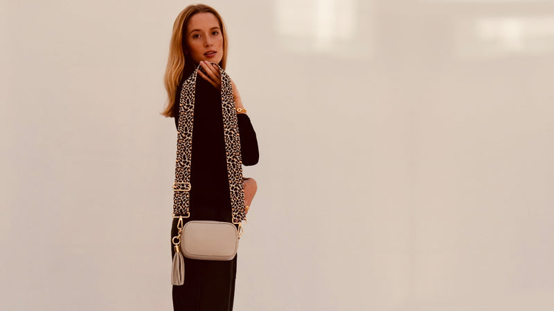 The Mini Tassel Light Grey Leather Phone Bag With Neon Pink Cross-Stitch Strap